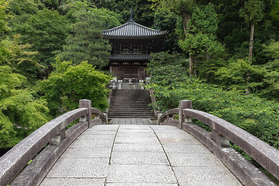 Stone bridge leading to a cemetery surrounded by trees in the compounds of Chion-in Kyoto  — Kyoto, Japan