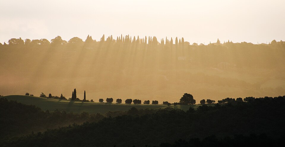 Morning in Tuscany with crepuscular rays — Val d'Orcia, Italy
