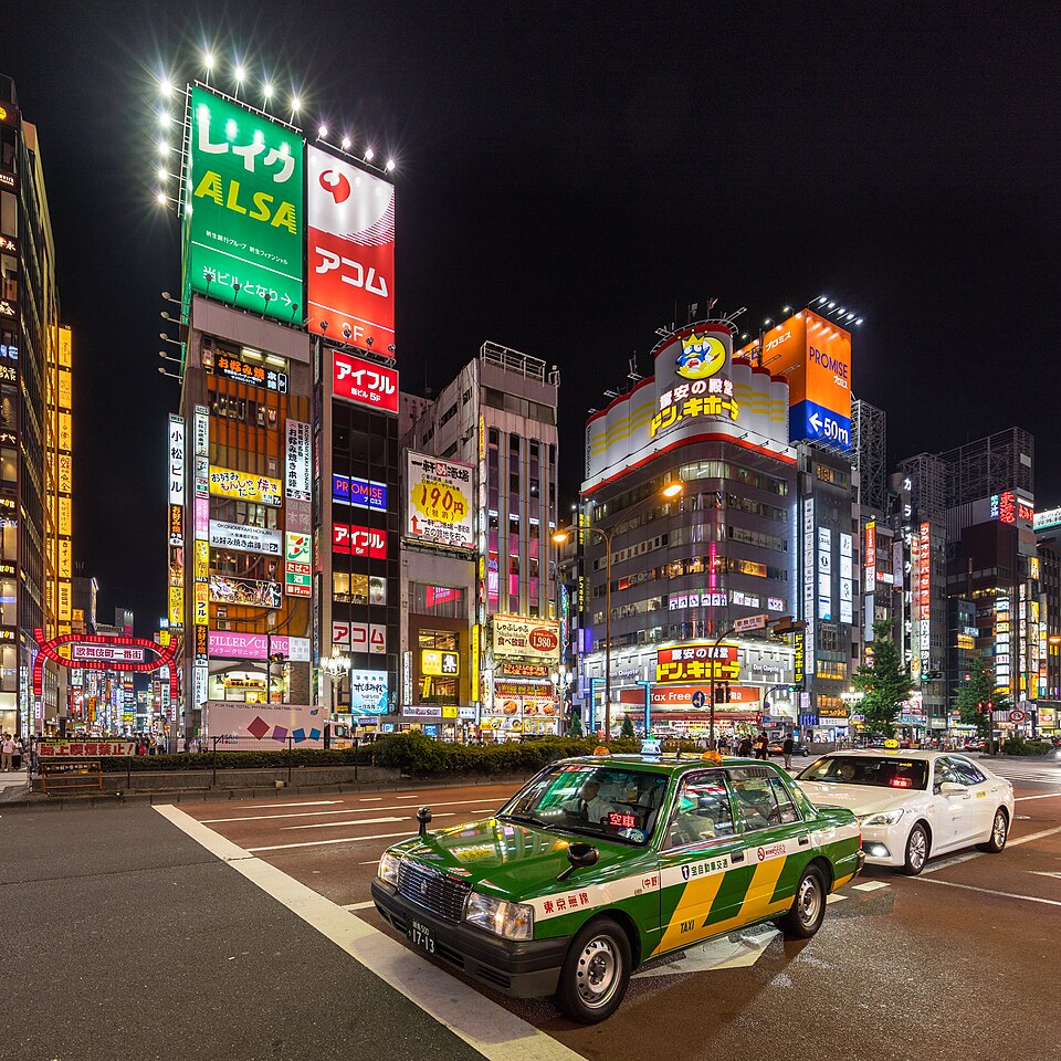 Yasukuni-dori Avenue at night with taxis and colorful neon street signs, Shinjuku, Tokyo,  — Tokyo, Japan